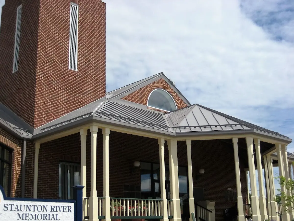 Skilled roofing craftsmen working on a residential roof in Carroll Corners
